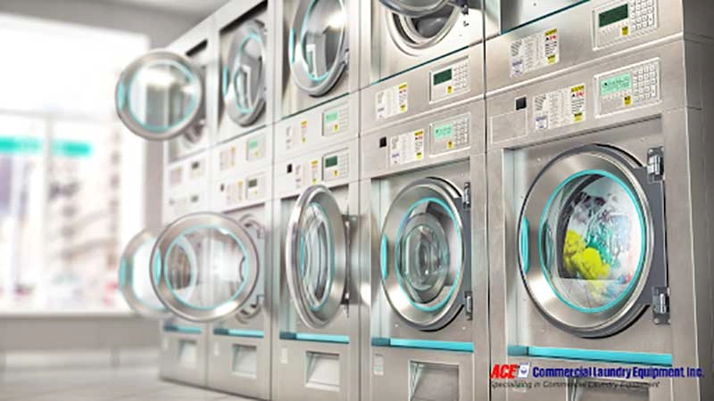Energy-efficient commercial washing machines in a well-maintained laundry facility, optimised for reducing water, electricity, and gas costs.