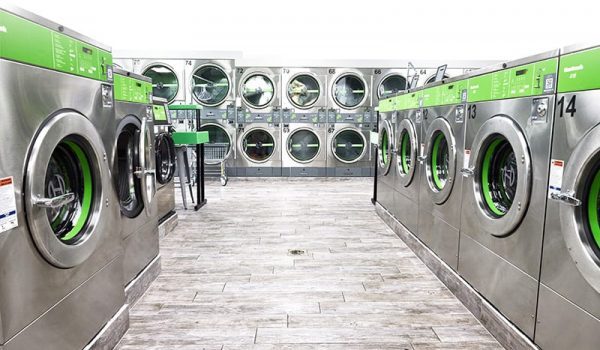 Huebsch coinless and coin operated laundry equipment for sale in a commercial laundromat